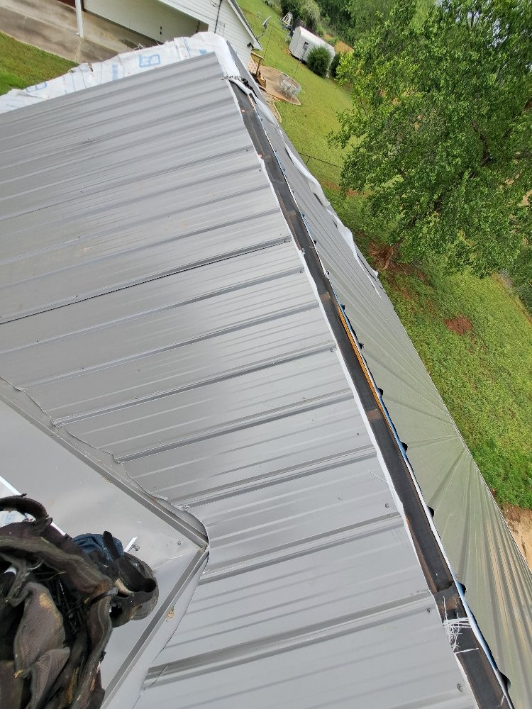 Slide of Mike's roofing and repairs