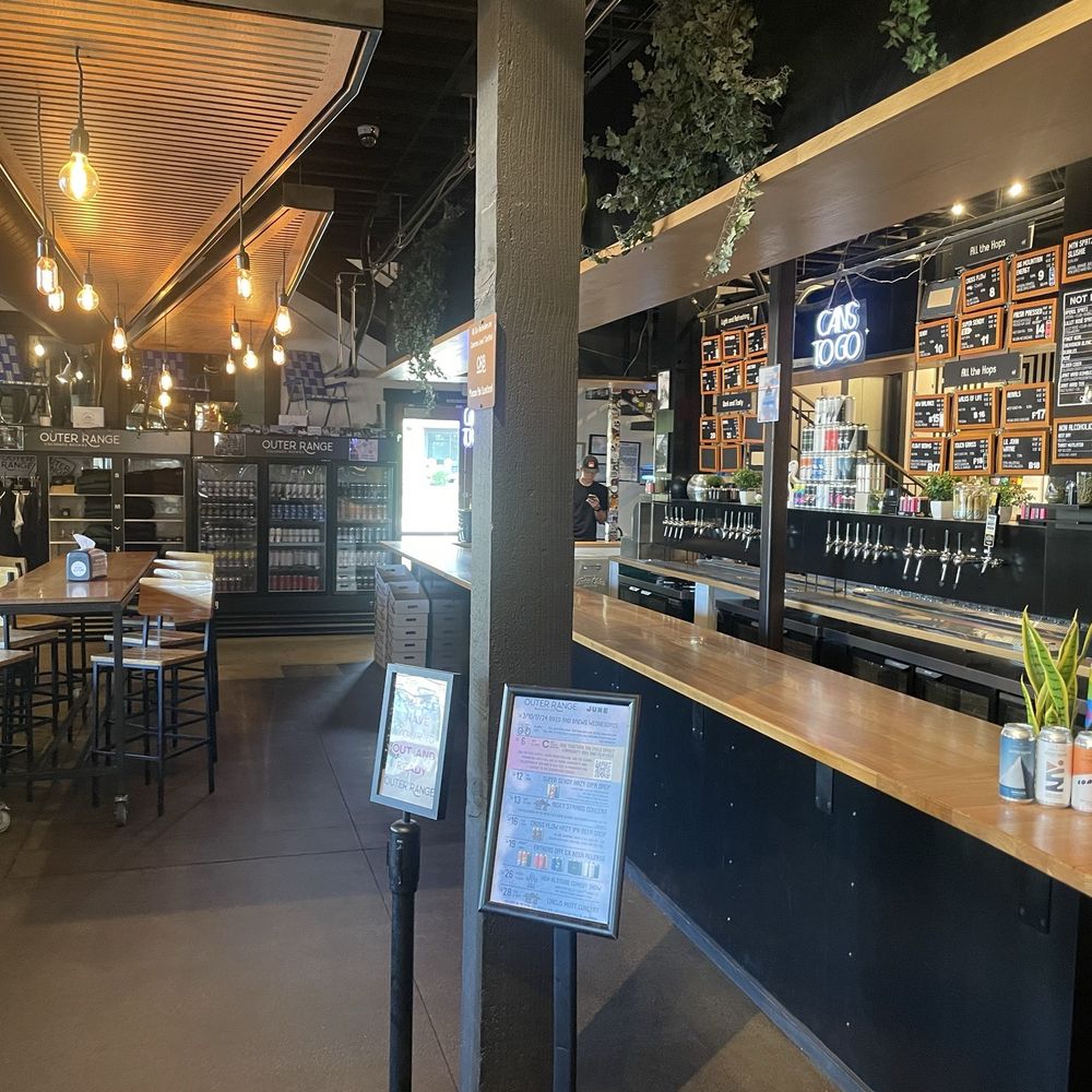 Mountain Dweller Coffee Roasters - The main bar downstairs with the coffee shop behind it - Coffee Roasteries Near Me - Frisco, Colorado