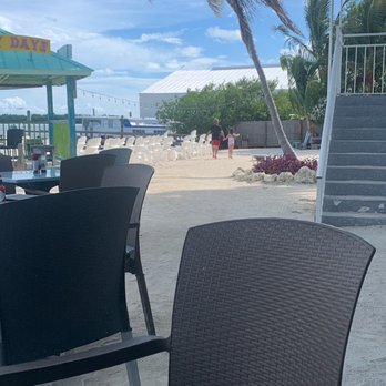 Lazy Days Restaurant - Downstairs seating by the waterfront - Seafood Near Me - Islamorada, Florida Lazy Days Restaurant - Downstairs seating by the waterfront - Seafood Near Me - Islamorada, Florida