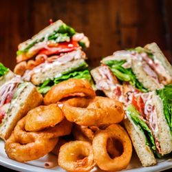 Scoundrels Tavern & Eatery - Turkey Bacon Club with onion rings