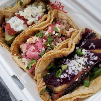 Righteous Cuisine - (Left to right) s&S Lamb, chicken, crispy pork belly tacos - Mexican Near Me - Grand Haven, Michigan