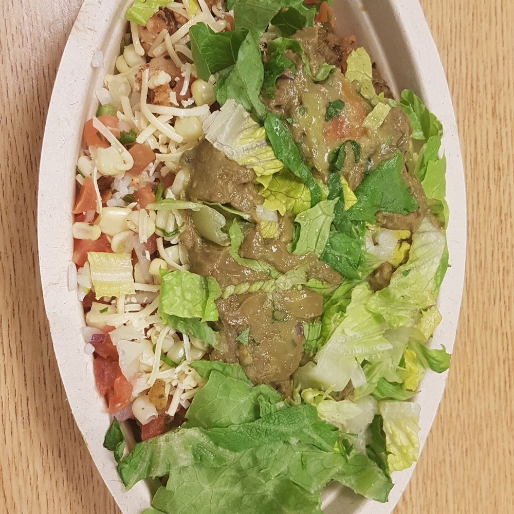 Chicken bowl, lettuce, guac, fresh salsa, corn salsa, green salsa with white rice