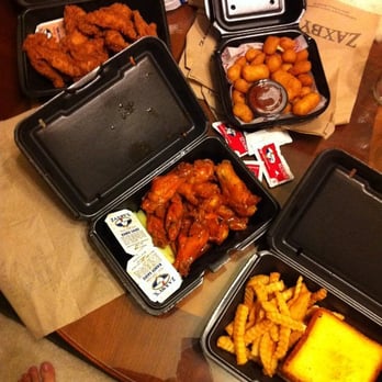 Zaxbys - Wings in Torchy's sauce, cheese bites, chicken tenders, chicken strip sandwich with fries - Chicken Wings Near Me - Houston, Texas Zaxbys - Wings in Torchy's sauce, cheese bites, chicken tenders, chicken strip sandwich with fries - Chicken Wings Near Me - Houston, Texas