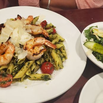 Basilico Italiano - Pesto pasta tossed with homemade pesto and cherry tomatoes, topped with shaved parmesan, served with kale salad. - Italian Near Me - Concord, North Carolina Basilico Italiano - Pesto pasta tossed with homemade pesto and cherry tomatoes, topped with shaved parmesan, served with kale salad. - Italian Near Me - Concord, North Carolina