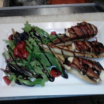 Conrads - Prosciutto mozzarella over fresh garlic bread and greens topped with balsamic reduction. Good app - Seafood Near Me - Walpole, Massachusetts Conrads - Prosciutto mozzarella over fresh garlic bread and greens topped with balsamic reduction. Good app - Seafood Near Me - Walpole, Massachusetts