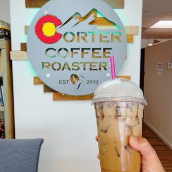 Corter Coffee Roasters - Iced Honey Lavender latte with a hint of lavender color whip cream - Coffee Roasteries Near Me - Colorado Springs, Colorado Corter Coffee Roasters - Iced Honey Lavender latte with a hint of lavender color whip cream - Coffee Roasteries Near Me - Colorado Springs, Colorado