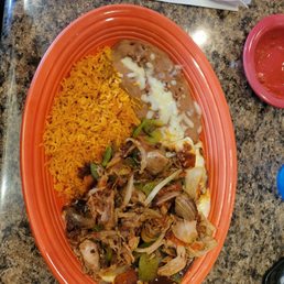a plate of mexican food on a table