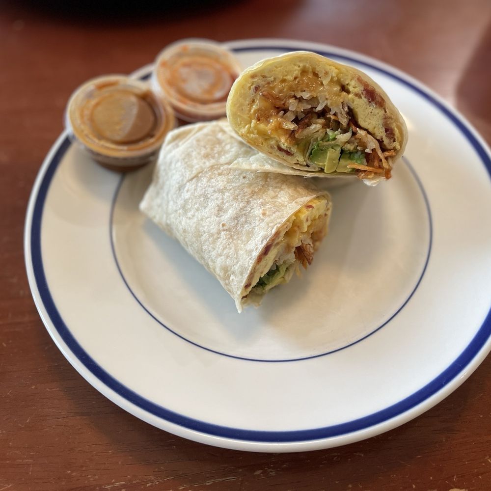 Captain Mauri's - Breakfast Burrito - eggs, bacon, cheese and added hash browns and avocado. - Juice Bars & Smoothies Near Me - San Clemente, California Captain Mauri's - Breakfast Burrito - eggs, bacon, cheese and added hash browns and avocado. - Juice Bars & Smoothies Near Me - San Clemente, California