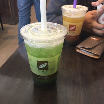 Cha For Tea - Long Beach - Mango green tea (with boba) in the back and Green apple iced tea in the front (with boba and aloe Vera bits) - Coffee & Tea Near Me - Long Beach, California Cha For Tea - Long Beach - Mango green tea (with boba) in the back and Green apple iced tea in the front (with boba and aloe Vera bits) - Coffee & Tea Near Me - Long Beach, California