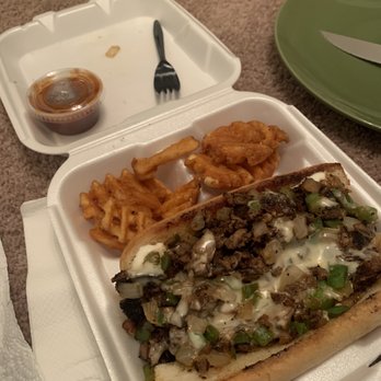 The Taste - a sandwich and french fries in a styrofoam container - Food Trucks Near Me
