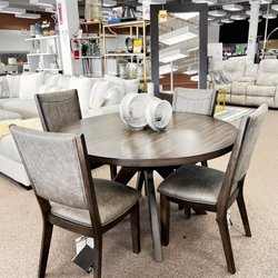 Factory Furniture Outlet - Round dining room set by Ashley furniture