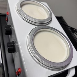 Brazils Waxing Center - Custom-blended wax warming fresh for smooth, effective hair removal.