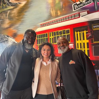 Darrow's New Orleans Grill - Picture with Norwood in front of his ionic wall of New Orleans - Cajun/Creole Near Me - Carson, California