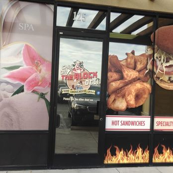 The Butcher Block - a woman eating a hot dog - Meat Shops Near Me - Las Vegas, Nevada
