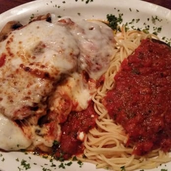 Caruso's Italian Kitchen - Eggplant parmigiana. The dinner plate comes with salad, garlic bread and vegetables. Portions are large - Cocktail Bars Near Me - Tujunga, California Caruso's Italian Kitchen - Eggplant parmigiana. The dinner plate comes with salad, garlic bread and vegetables. Portions are large - Cocktail Bars Near Me - Tujunga, California