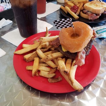 Obi's Fillin Station - The "Spare Tire" Cheeseburger with American cheese and bacon served on two Krispy Kreme donuts. - American Near Me - Saint Augustine, Florida