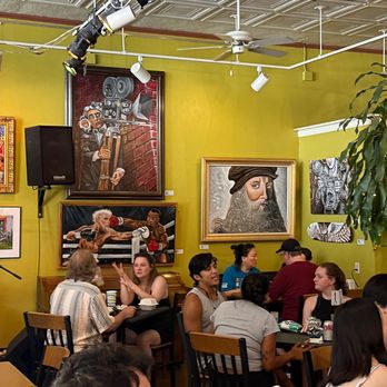 NeWorlDeli - Live stage and art surround a hungry audience at NeWorlDeli - Delis Near Me - Austin, Texas NeWorlDeli - Live stage and art surround a hungry audience at NeWorlDeli - Delis Near Me - Austin, Texas