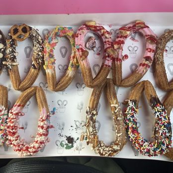 Churro On Top - Box of 12, minus the one my husband ate before I took the photo. - Desserts Near Me - Arlington, Texas