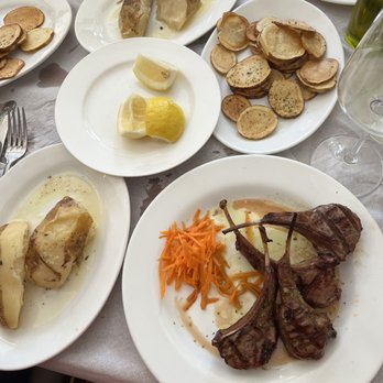 Loukoumi Taverna - Baby man with side dish of lemon potatoes and French Fries styled by the restaurant. - Greek Near Me - Astoria, New York Loukoumi Taverna - Baby man with side dish of lemon potatoes and French Fries styled by the restaurant. - Greek Near Me - Astoria, New York