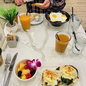 SweetDiner - Eggs Benedict, skillet and juices on a beautiful table in a gorgeous place that has wonderful service! - Diners Near Me - Milwaukee, Wisconsin