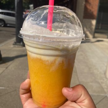 Monte Rossa Cafe - a hand holding a cup of orange juice - Coffee & Tea Near Me - Portland, Oregon Monte Rossa Cafe - a hand holding a cup of orange juice - Coffee & Tea Near Me - Portland, Oregon