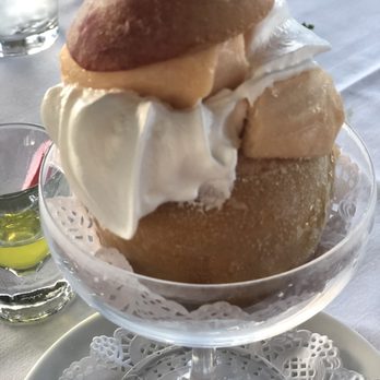 Mimi' & Coco' Bistro - Peach Sorbet in frozen peach fruit - Cocktail Bars Near Me - Henderson, Nevada