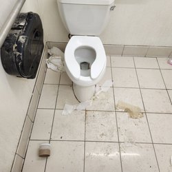 Look how nasty the floor is. And how many times have they taped the toilet paper dispenser to keep it closed? What a rat hole.