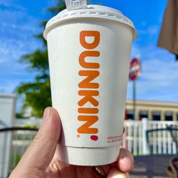 Dunkin' - Medium cup of coffee outdoors - Coffee & Tea Near Me - Nokomis, Florida Dunkin' - Medium cup of coffee outdoors - Coffee & Tea Near Me - Nokomis, Florida