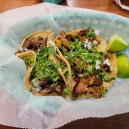 Taco Al Pastor (pork) and Taco Carne Asada (skirt steak)