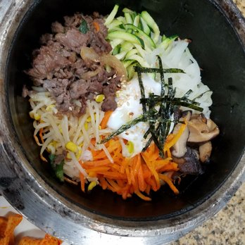 Korean Grill - Dolsot Bibimbap. The server had to teach us to mix it all together before the rice caramelized on the sizzling bottom. - Korean Near Me - Austin, Texas
