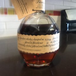 a bottle of bourbon on a counter a bottle of bourbon on a counter
