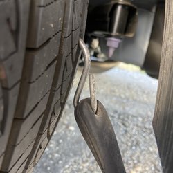 American Wheel & Tire - S bungee hook stuck in my tire. Juan was able to plug patch it!