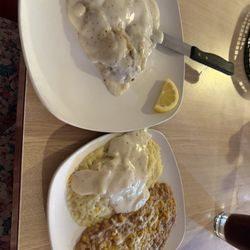 Ranch Grill - Chicken fried steak with a side of mashed potatoes and gravy and refried beans