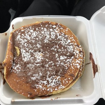 Athena's - 3 pancakes. So big they can barely fit in a to-go box! Nutella spread on each pancake - Breakfast & Brunch Near Me - Cranston, Rhode Island