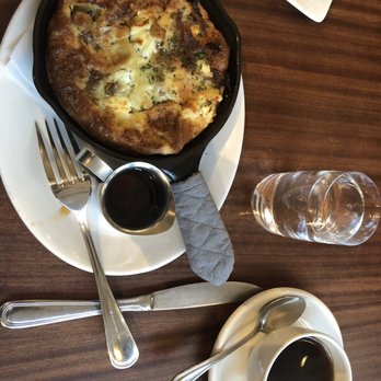 Tilikum Place Cafe - Savory Dutch Baby duck confit, balsamic onions, goat cheese, apples, sage add a tiny drizzle of syrup, you will not regret it! - New American Near Me - Seattle, Washington