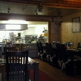 Lalezar - Dining flanked by the open kitchen... - Turkish Near Me - Amsterdam, New Hampshire Lalezar - Dining flanked by the open kitchen... - Turkish Near Me - Amsterdam, New Hampshire