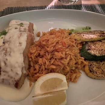 POM Restaurant - Pacific Sea Bass with Spanish rice and roasted vegetables with a citrus butter sauce and cilantro aïoli. Amazing!! - New American Near Me - Indio, California POM Restaurant - Pacific Sea Bass with Spanish rice and roasted vegetables with a citrus butter sauce and cilantro aïoli. Amazing!! - New American Near Me - Indio, California