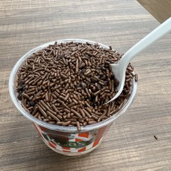 Rita's Italian Ice & Frozen Custard - Hot fudge sundae with vanilla and strawberry custard topped with chocolate sprinkles and chocolate chips