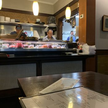 Wild Ginger - a restaurant counter with a menu on it - Asian Fusion Near Me - Smithtown, New York