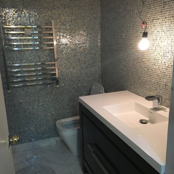 Studio41 Home Design Showroom - Had to take out the towel heater because it stuck out too far. They exchanged it for the towel bar in the next picture. - Kitchen & Bath Near Me - Chicago, Illinois Studio41 Home Design Showroom - Had to take out the towel heater because it stuck out too far. They exchanged it for the towel bar in the next picture. - Kitchen & Bath Near Me - Chicago, Illinois