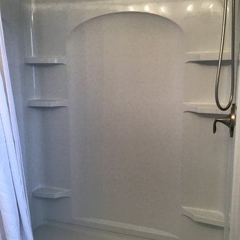 Trust Plumbing - a shower with a white shower curtain - Plumbing Near Me - Troy, Ohio Trust Plumbing - a shower with a white shower curtain - Plumbing Near Me - Troy, Ohio