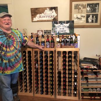 Reid's Livery - a man standing in front of a wine rack - Wineries Near Me - Alvaton, Kentucky
