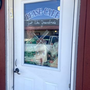 Pease Cafe - Entrance to Pease Cafe but with owner in the window. - Coffee & Tea Near Me - Pease, Minnesota