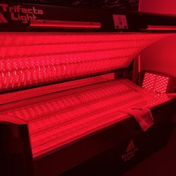 Lite Body Sculpting - Red light therapy bed. The light on the end is used for either foot pain/neuropathy.
