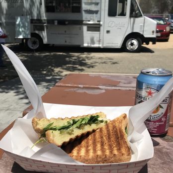 Dahlia Eatery - a sandwich and a can of soda - Food Trucks Near Me Dahlia Eatery - a sandwich and a can of soda - Food Trucks Near Me