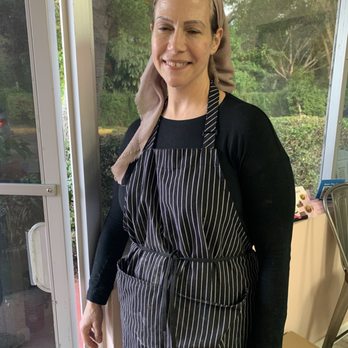 Dikla Delicious - a woman standing in front of a window - Desserts Near Me - Hollywood, Florida