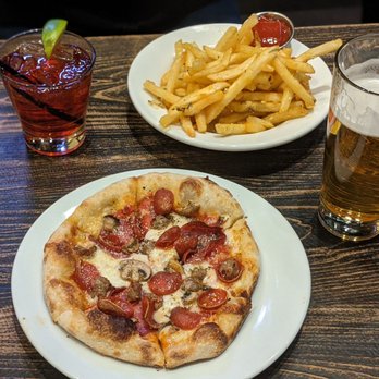Pizza Rock - Rosemary garlic fries with *ranch(not in picture), Tony Two Times pizza, cranberry vodka and Able Baker Atomic Duck IPA. - Pizza Near Me - Henderson, Nevada