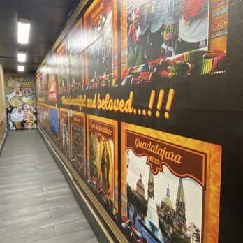 El Pollo Norteno - a long corridor with posters on the walls - Mexican Near Me - Lake Forest, California El Pollo Norteno - a long corridor with posters on the walls - Mexican Near Me - Lake Forest, California
