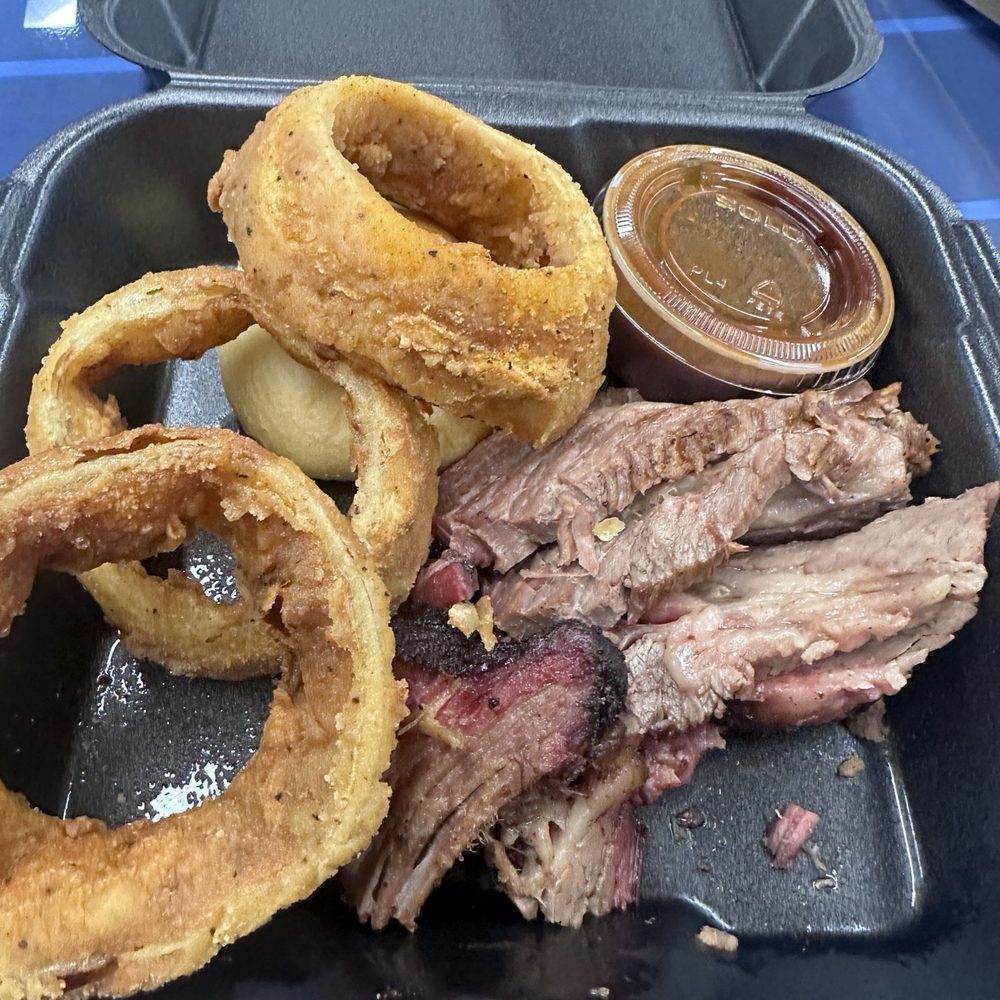 Sonny Bryan's Smokehouse - One meat lunch special - sliced brisket with onion rings. - Barbeque Near Me - Dallas, Texas Sonny Bryan's Smokehouse - One meat lunch special - sliced brisket with onion rings. - Barbeque Near Me - Dallas, Texas
