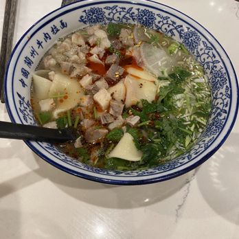 Highland Noodles - Beef hand pull noodle (wide flat with chili oil) - Noodles Near Me - Milpitas, California Highland Noodles - Beef hand pull noodle (wide flat with chili oil) - Noodles Near Me - Milpitas, California